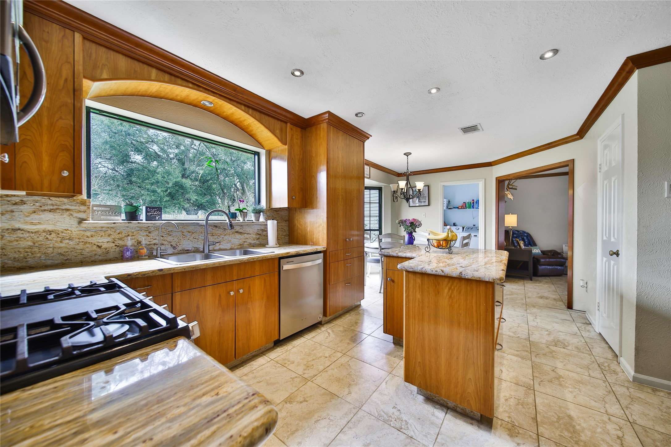 810 Noble Springs Road Houston, TX 77062 - Photo 8 of 27 a kitchen with stainless steel appliances granite countertop a sink stove and refrigerator