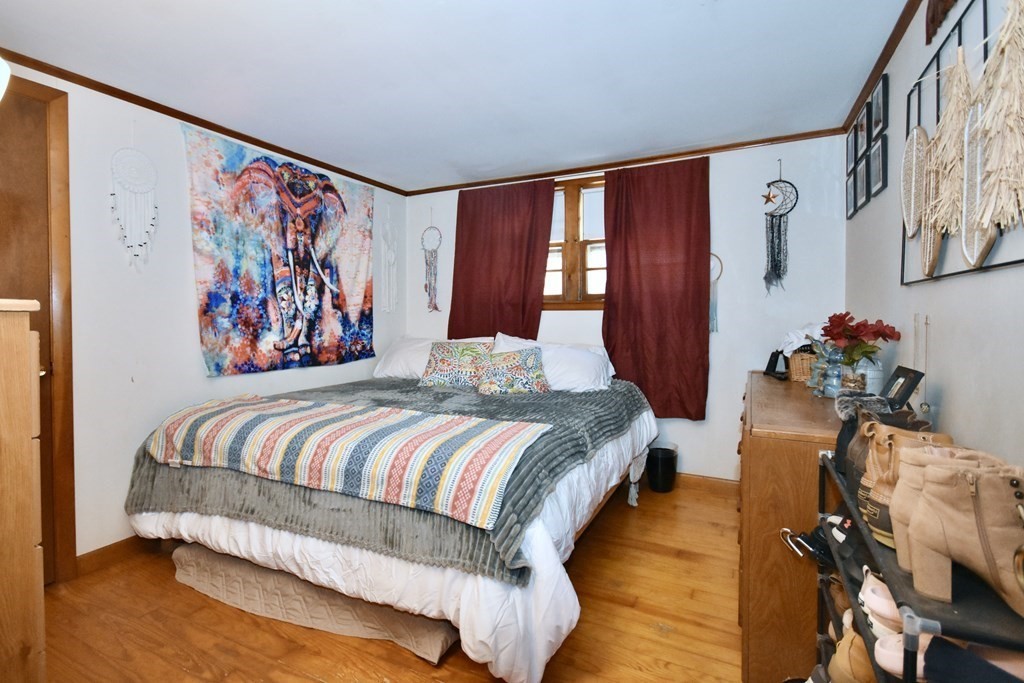 23 Trask Road Plymouth, MA 02360 - Photo 12 of 20 a bedroom with a bed and a painting on the wall