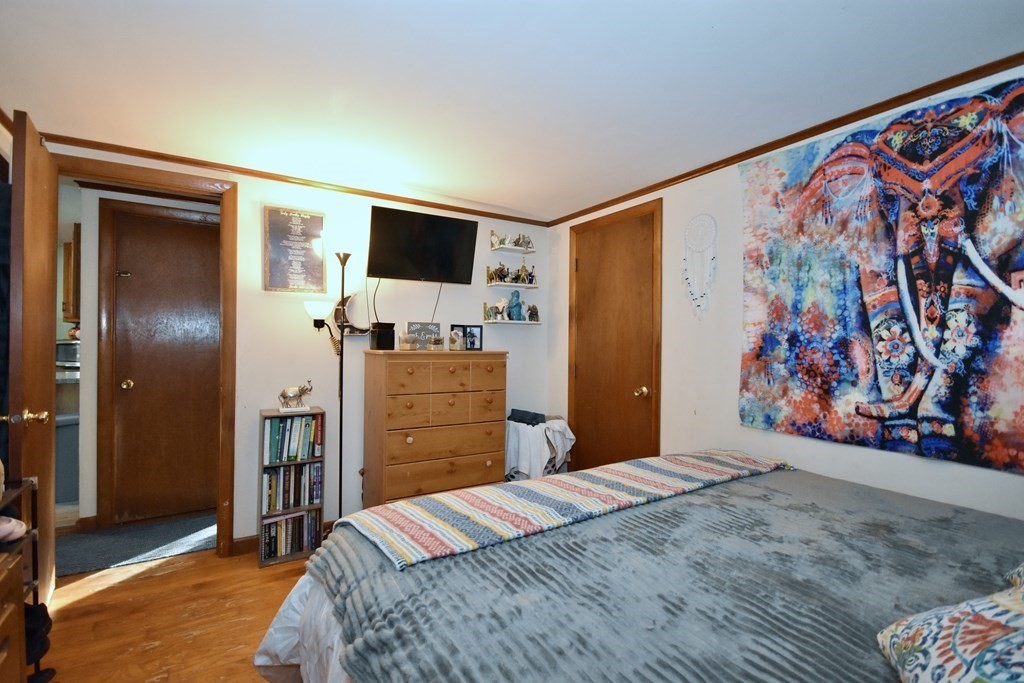 23 Trask Road Plymouth, MA 02360 - Photo 13 of 20 a bedroom with a bed and a flat screen tv