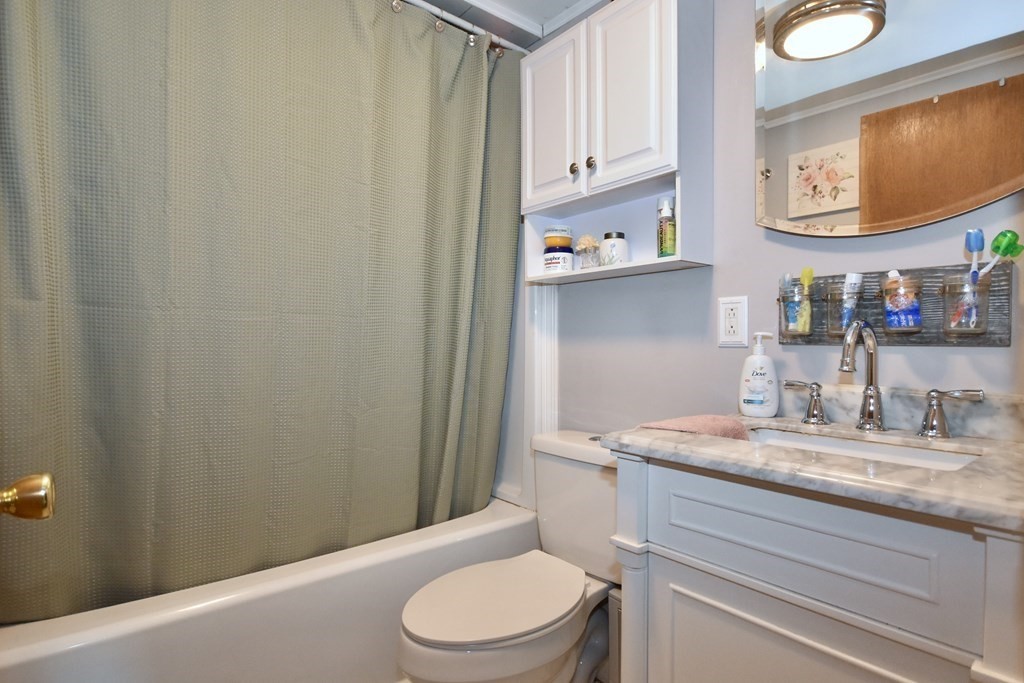 23 Trask Road Plymouth, MA 02360 - Photo 14 of 20 a bathroom with a granite countertop toilet sink and mirror