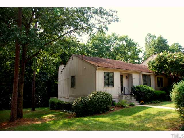 Private wooded side and back yard beautify  this end unit.