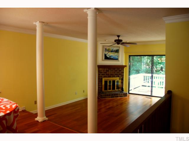 5825 Branchwood Road Raleigh, NC 27609 - Photo 12 of 12 Open floorplan with rich Pergo floors and corner fireplace