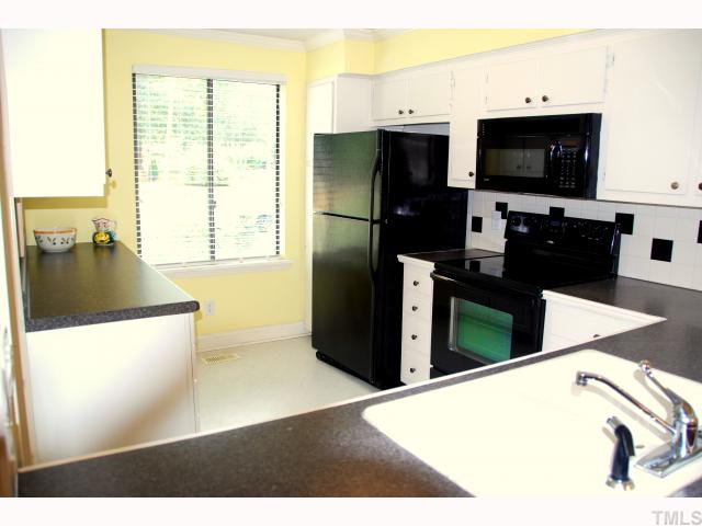 5825 Branchwood Road Raleigh, NC 27609 - Photo 3 of 12 Updated kitchen with new smoothtop stove, microwave, refrigerator all convey.
