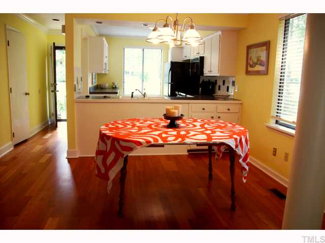 5825 Branchwood Road Raleigh, NC 27609 - Photo 5 of 12 Separate dining room with advantage of double window and updated chandalier.