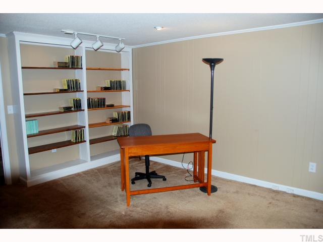 5825 Branchwood Road Raleigh, NC 27609 - Photo 7 of 12 Lower level has built-in bookcases, recessed and track lighting.
