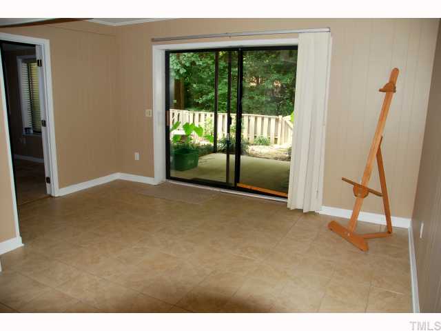 5825 Branchwood Road Raleigh, NC 27609 - Photo 9 of 12 Family room downstairs has 12" ceramic tile floors making it a perfect hobby space.