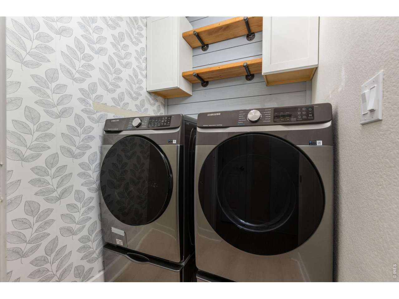 2002 Trail Ridge Drive Severance, CO 80615 - Photo 20 of 50 Laundry room with built in storage and custom shelving