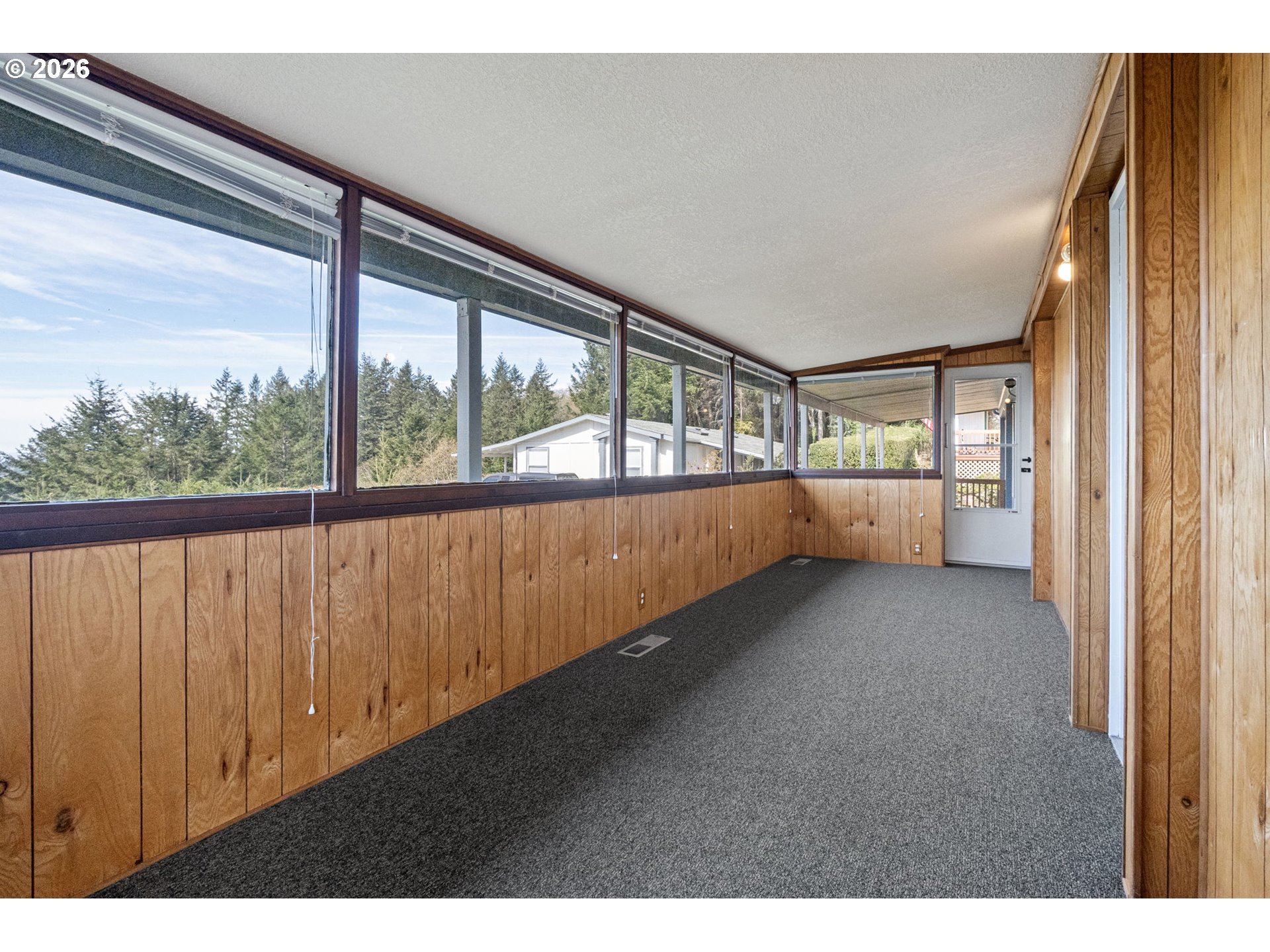98041 Hallway Road, Unit 41 Brookings, OR 97415 - Photo 33 of 48 a view of an empty room with a window