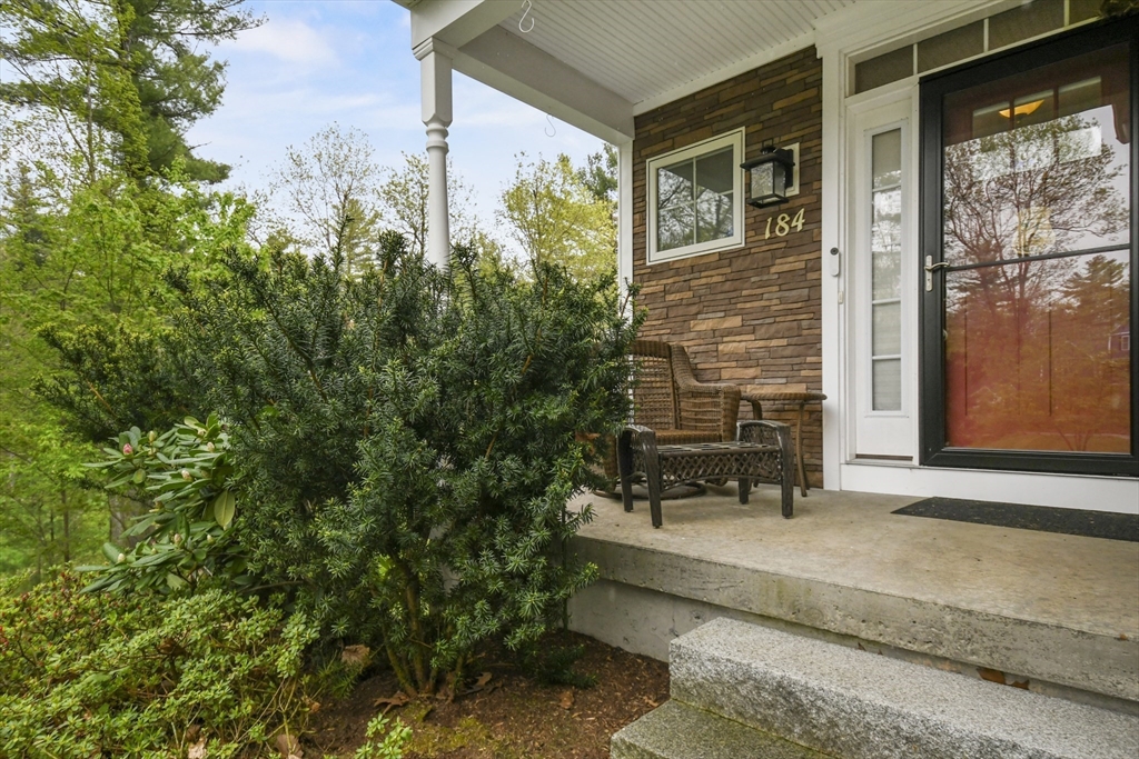 184 Glenwood Road Rutland, MA 01543 - Photo 3 of 41 a bench is sitting in front of a house