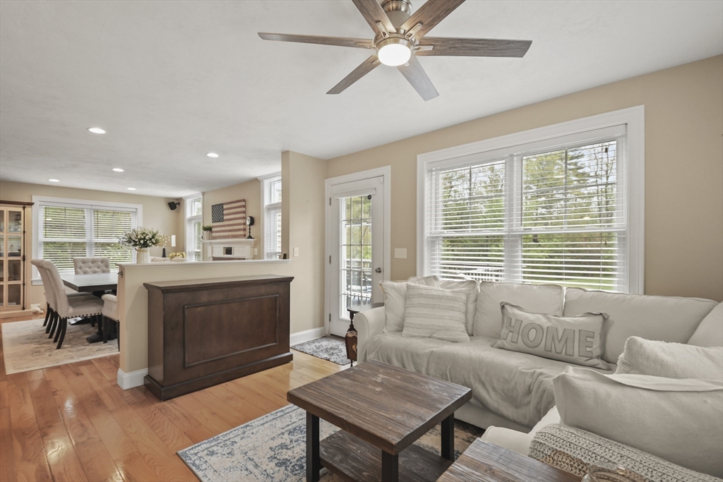 184 Glenwood Road Rutland, MA 01543 - Photo 8 of 41 a living room with furniture a fireplace and a table
