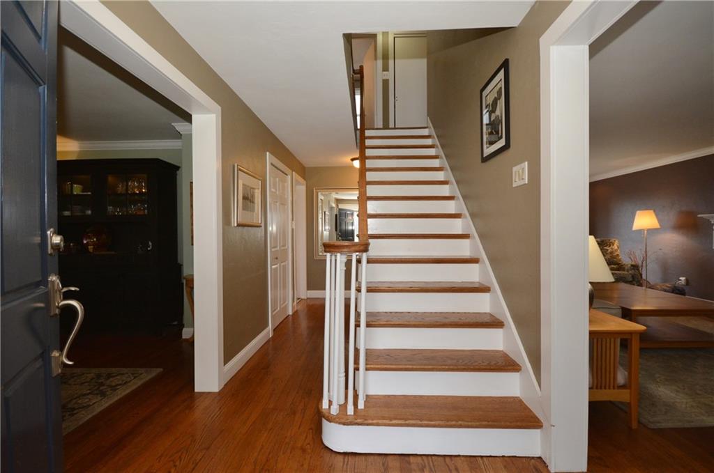520 Fort Couch Road Pittsburgh, PA 15241 - Photo 2 of 25 a view of a hallway with wooden floor and windows