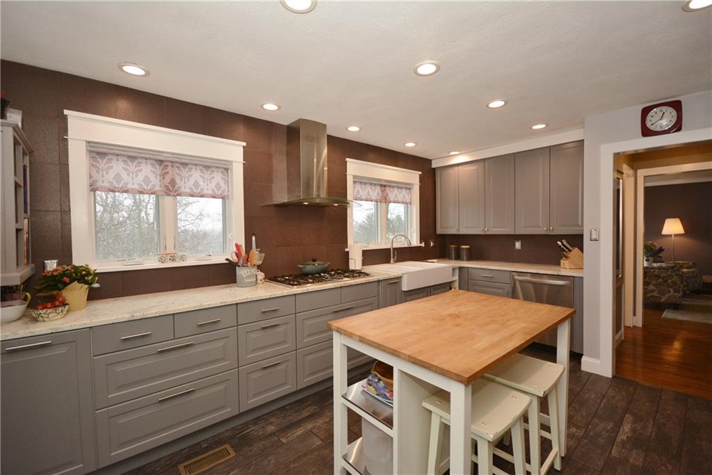 520 Fort Couch Road Pittsburgh, PA 15241 - Photo 9 of 25 a kitchen with a sink a counter top space and living room view