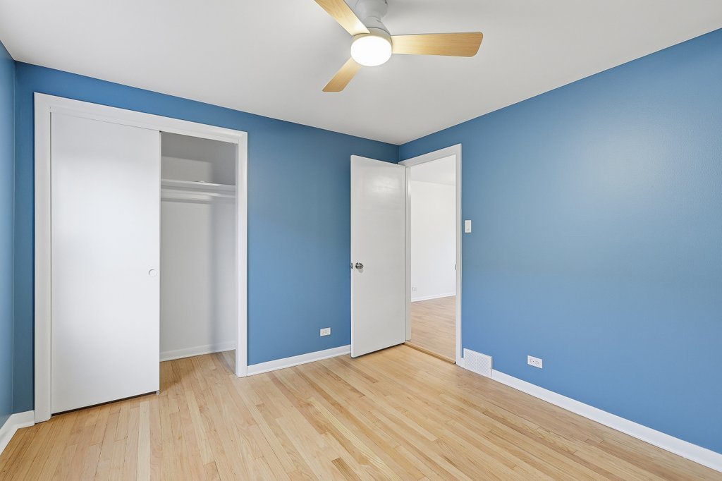 3840 South Wolcott Avenue, Unit 2 Chicago, IL 60609 - Photo 11 of 17 a view of an empty room with wooden floor