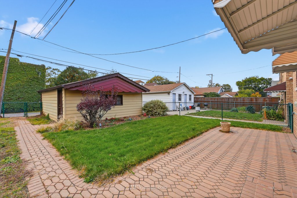 3840 South Wolcott Avenue, Unit 2 Chicago, IL 60609 - Photo 15 of 17 a view of a house with a yard