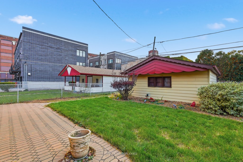 3840 South Wolcott Avenue, Unit 2 Chicago, IL 60609 - Photo 16 of 17 a view of a house with a yard