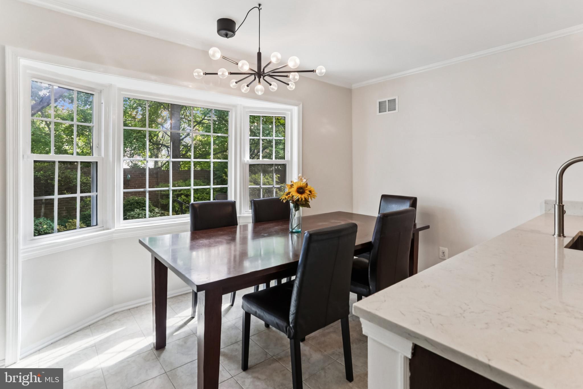 10233 Gainsborough Road Potomac, MD 20854 - Photo 12 of 50 a view of a workspace with furniture and a window
