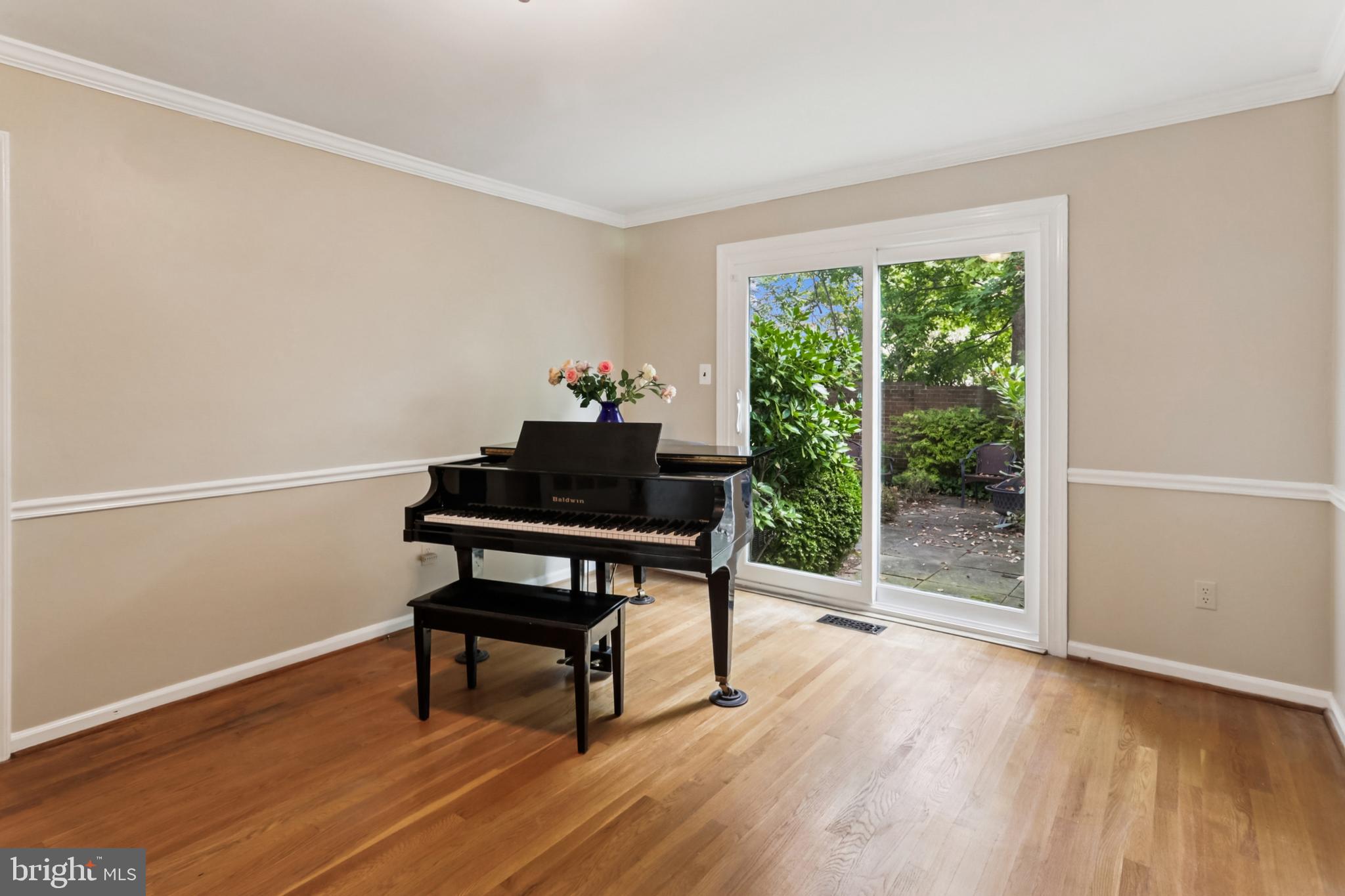 10233 Gainsborough Road Potomac, MD 20854 - Photo 17 of 50 a view of a workspace with wooden floor and a window