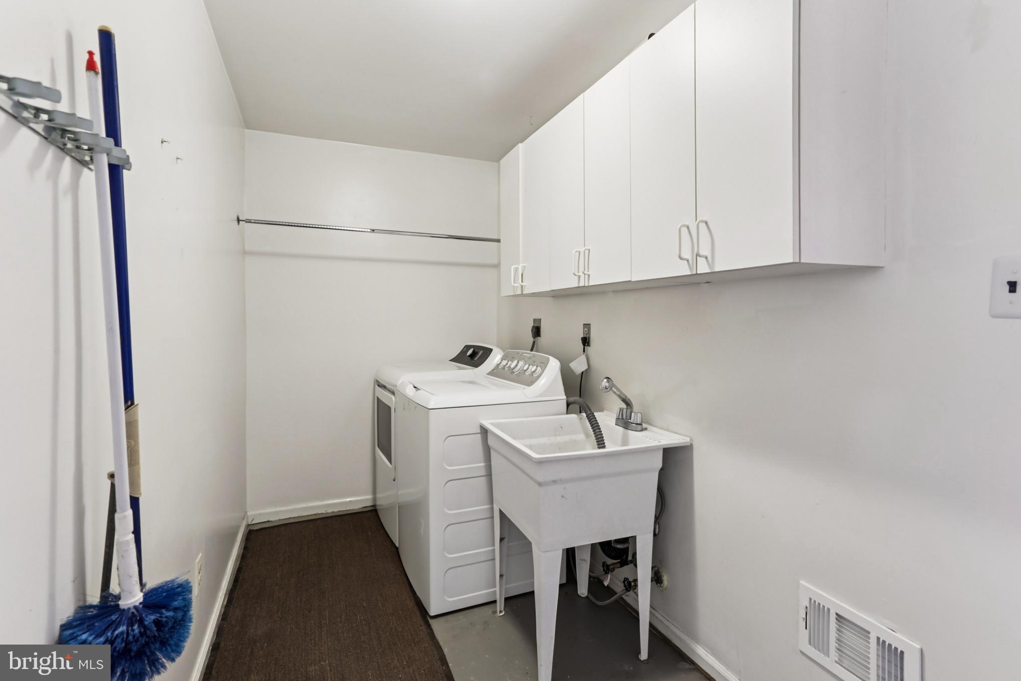 10233 Gainsborough Road Potomac, MD 20854 - Photo 22 of 50 a utility room with dryer and washer