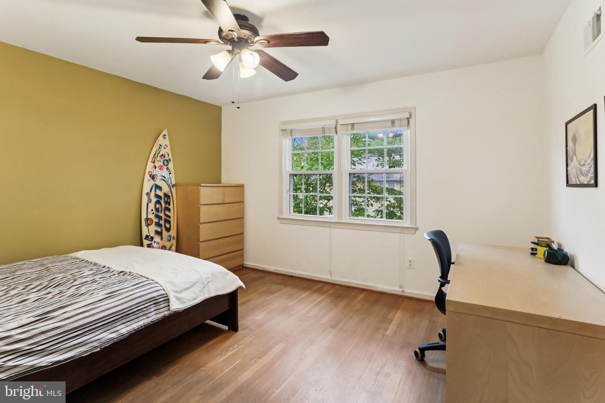 10233 Gainsborough Road Potomac, MD 20854 - Photo 25 of 50 a bedroom with a bed and a table with a chandelier