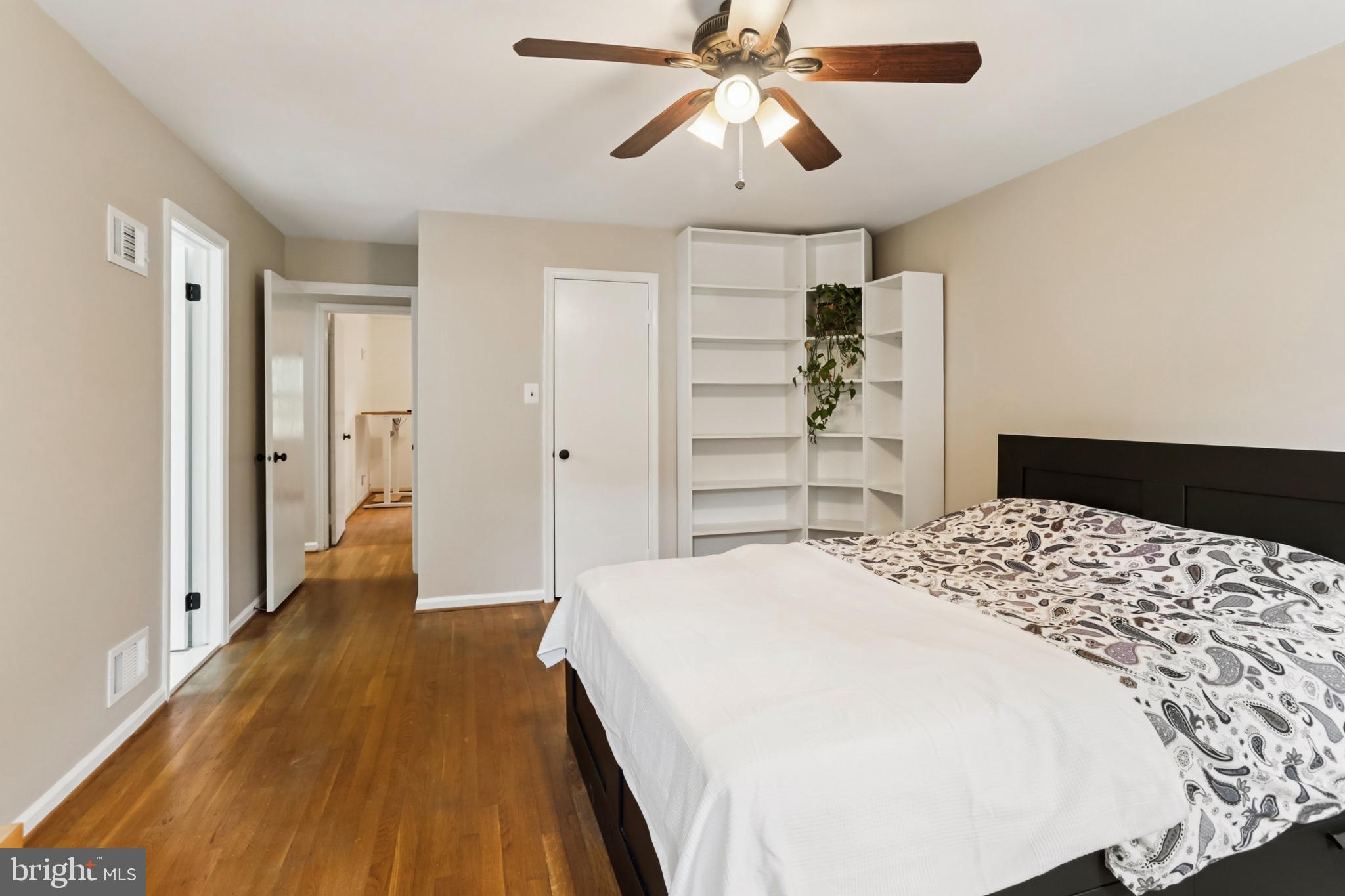 10233 Gainsborough Road Potomac, MD 20854 - Photo 35 of 50 a bedroom with a bed and a chandelier