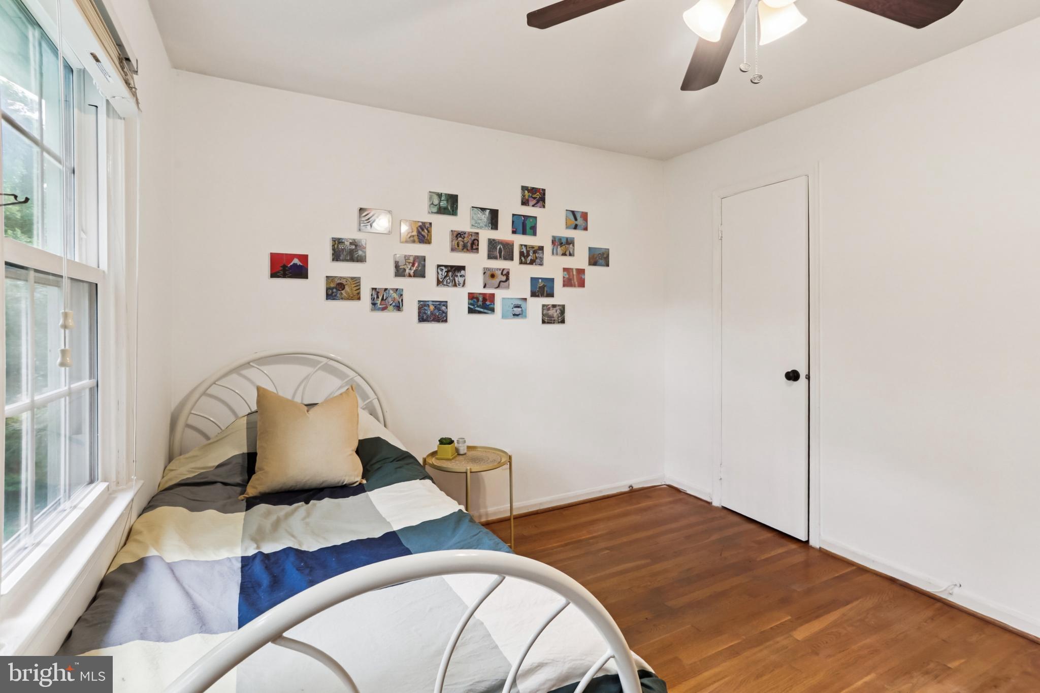 10233 Gainsborough Road Potomac, MD 20854 - Photo 38 of 50 a bedroom with a bed and chandelier