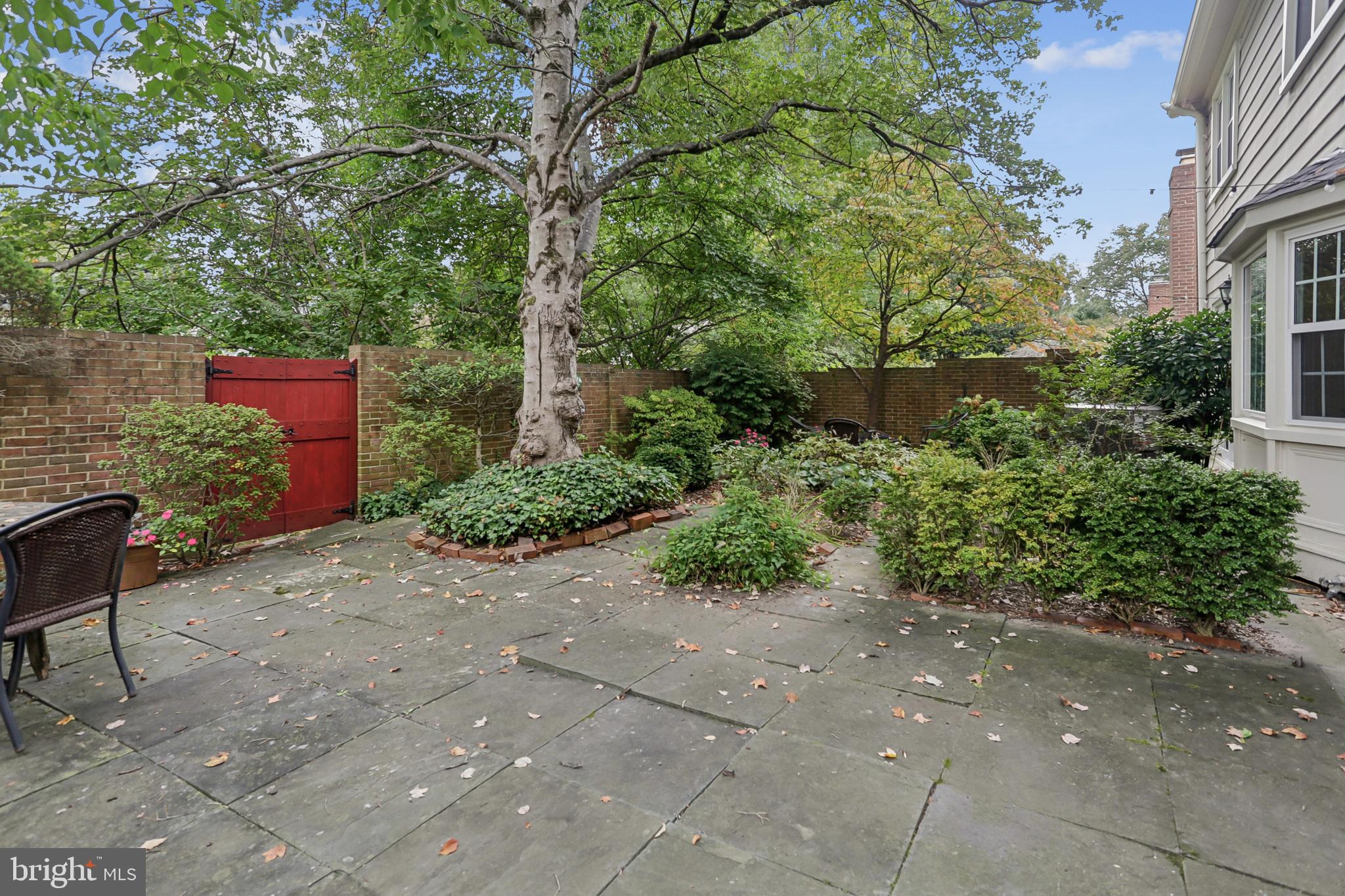 10233 Gainsborough Road Potomac, MD 20854 - Photo 45 of 50 a pathway of a house with a yard
