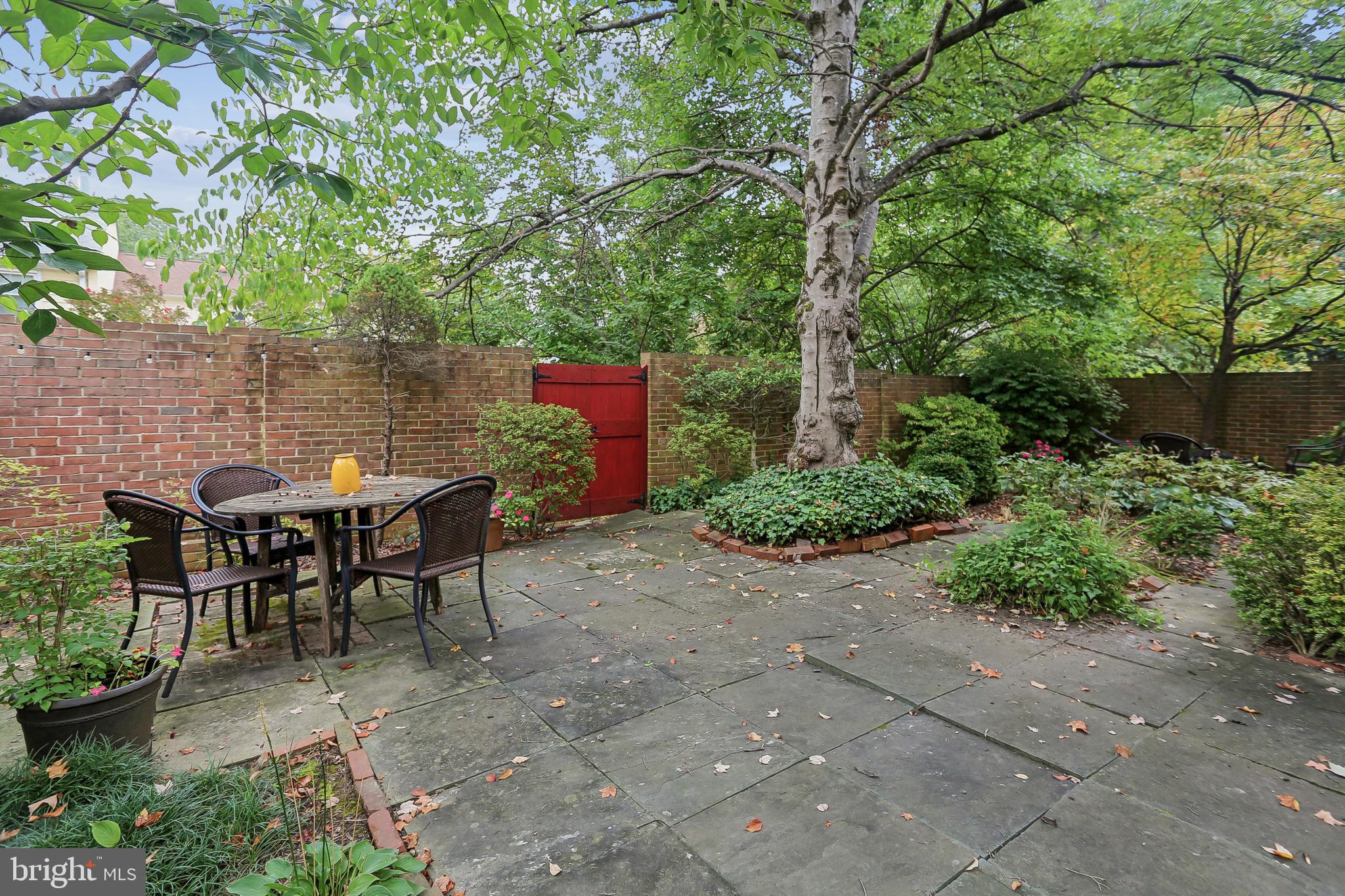 10233 Gainsborough Road Potomac, MD 20854 - Photo 46 of 50 a view of a tables and chairs in a backyard