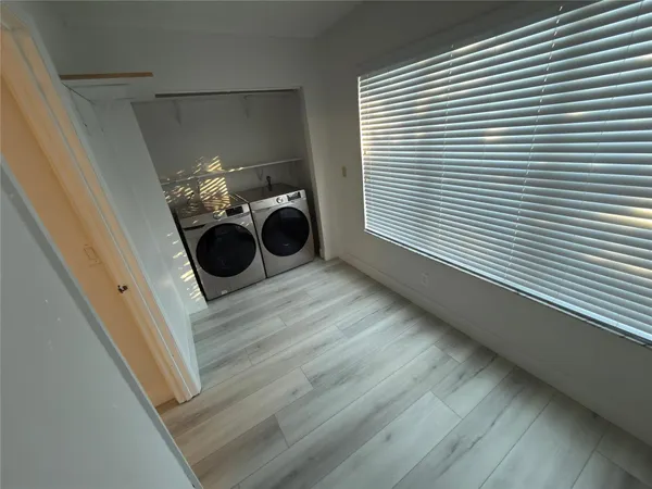 a view of a storage & utility room with a window