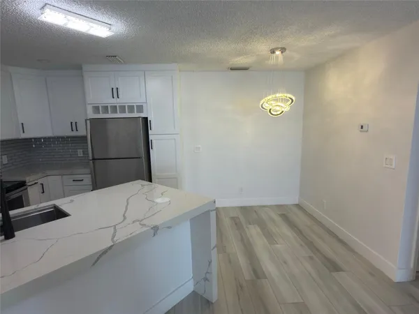 a view of a kitchen with a sink