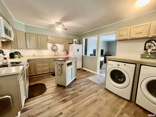a kitchen with a stove top oven sink and cabinets