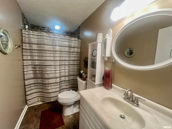 a bathroom with a toilet and a sink
