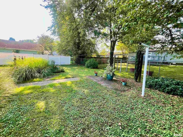 a view of a backyard with swimming pool