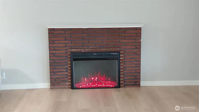 a stone fireplace with a fireplace