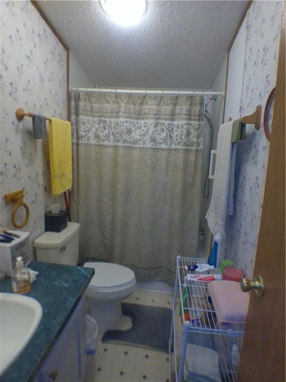 137 Brook Lane Valencia, PA 16059 - Photo 13 of 18 a bathroom with a granite countertop sink toilet and shower