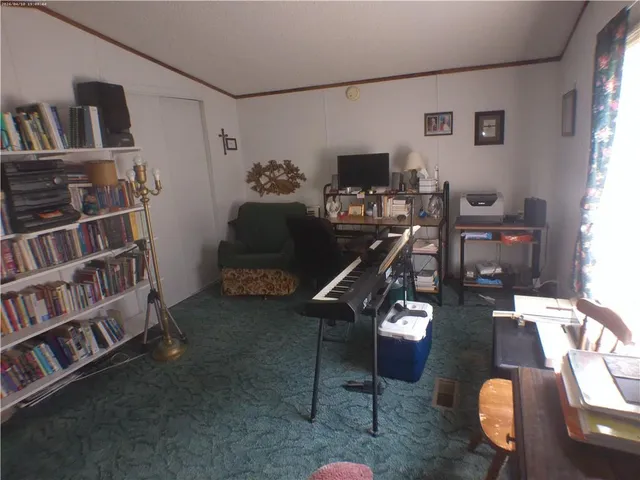 a bedroom with a bed and a table in it