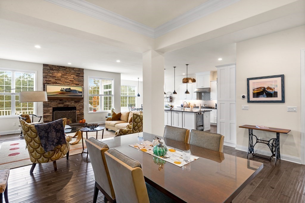 37 Pine Tree Drive, Unit 37 Methuen, MA 01844 - Photo 11 of 40 a living room with fireplace furniture and a wooden floor