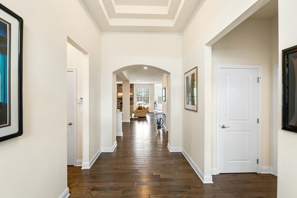 37 Pine Tree Drive, Unit 37 Methuen, MA 01844 - Photo 24 of 40 a view of a hallway view with wooden floor and living room