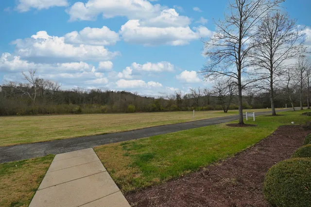 a kitchen with granite countertop stainless steel appliances and wooden cabinets