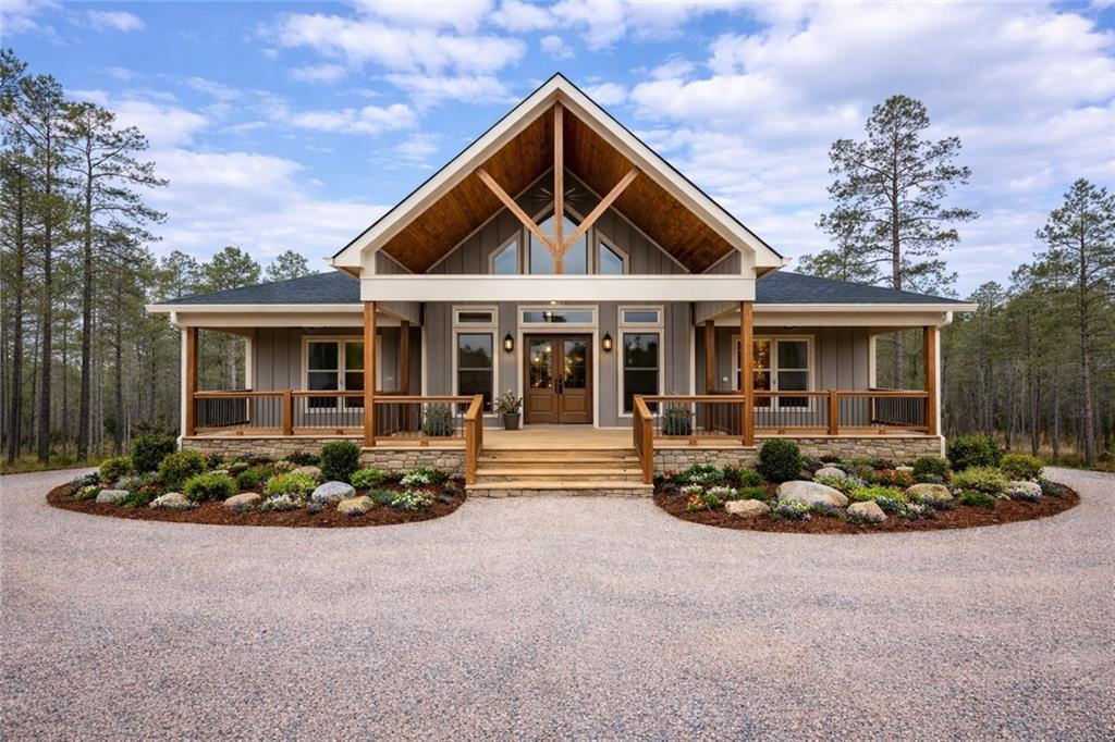 2956 Blalock Mountain Road Talking Rock, GA 30175 - Photo 64 of 65 a front view of a house with a garden