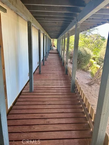 a view of a porch with wooden stairs