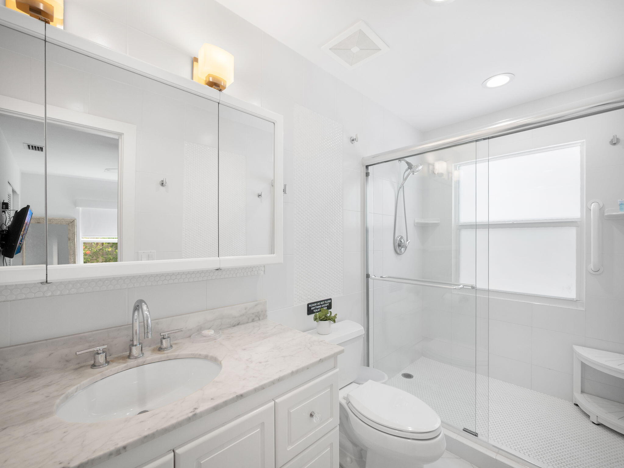 471 Mars Way Juno Beach, FL 33408 - Photo 17 of 29 a bathroom with a granite countertop sink a toilet and shower