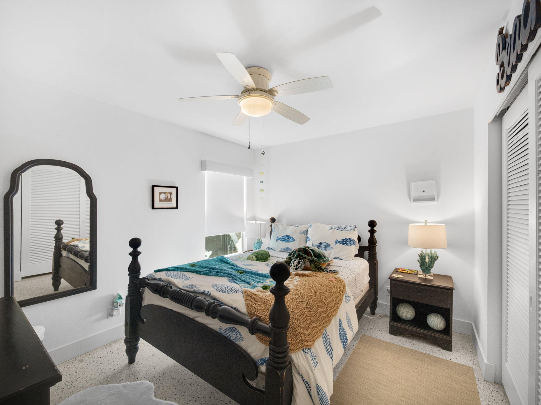 471 Mars Way Juno Beach, FL 33408 - Photo 18 of 29 a bed room with a bed and a chandelier