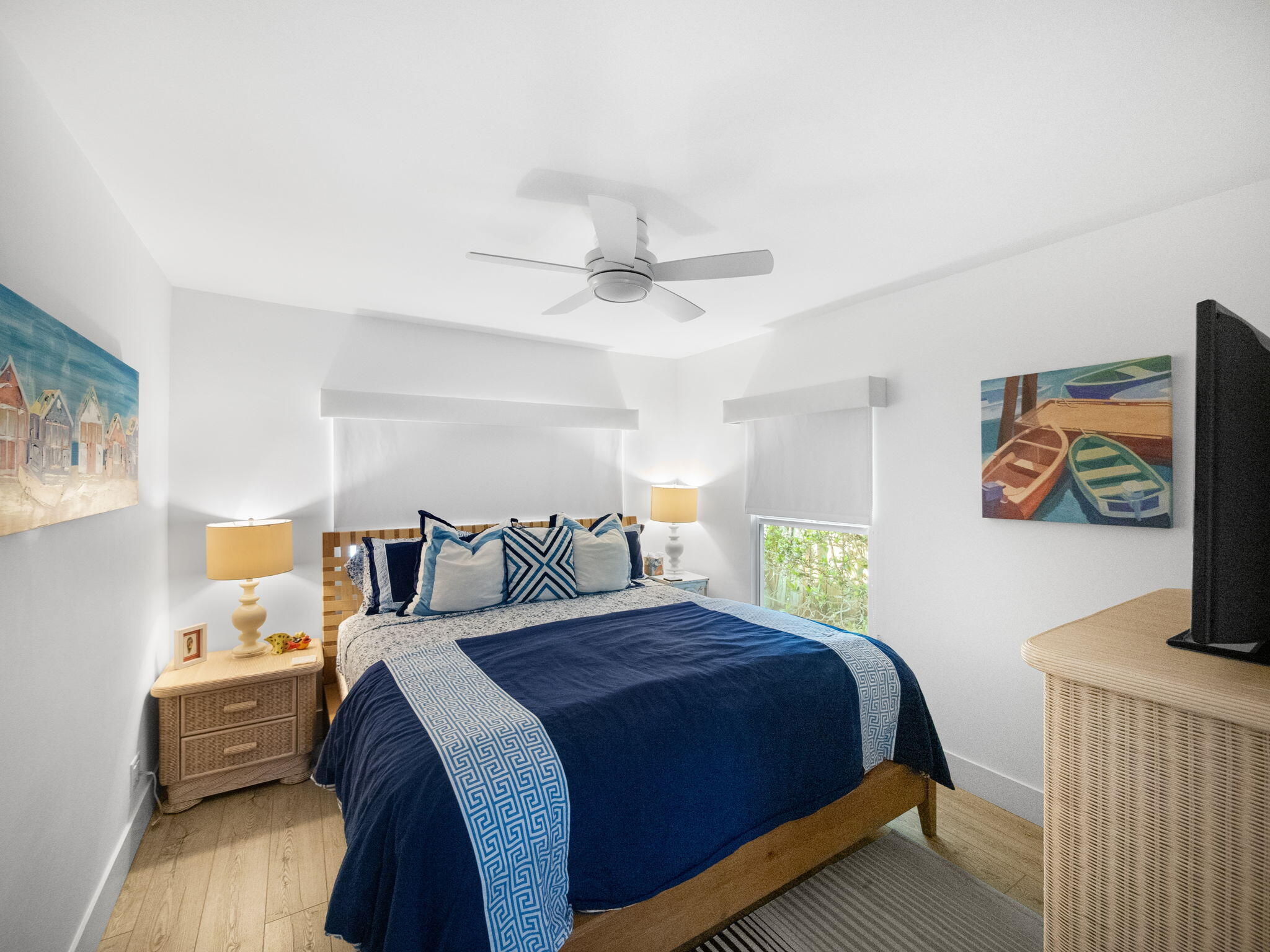 471 Mars Way Juno Beach, FL 33408 - Photo 21 of 29 a bedroom with a bed and a chandelier