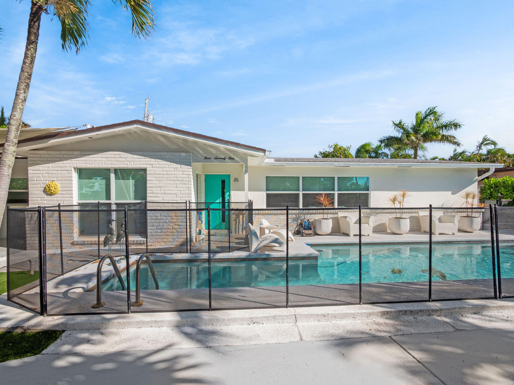 471 Mars Way Juno Beach, FL 33408 - Photo 27 of 29 a view of a house with a backyard
