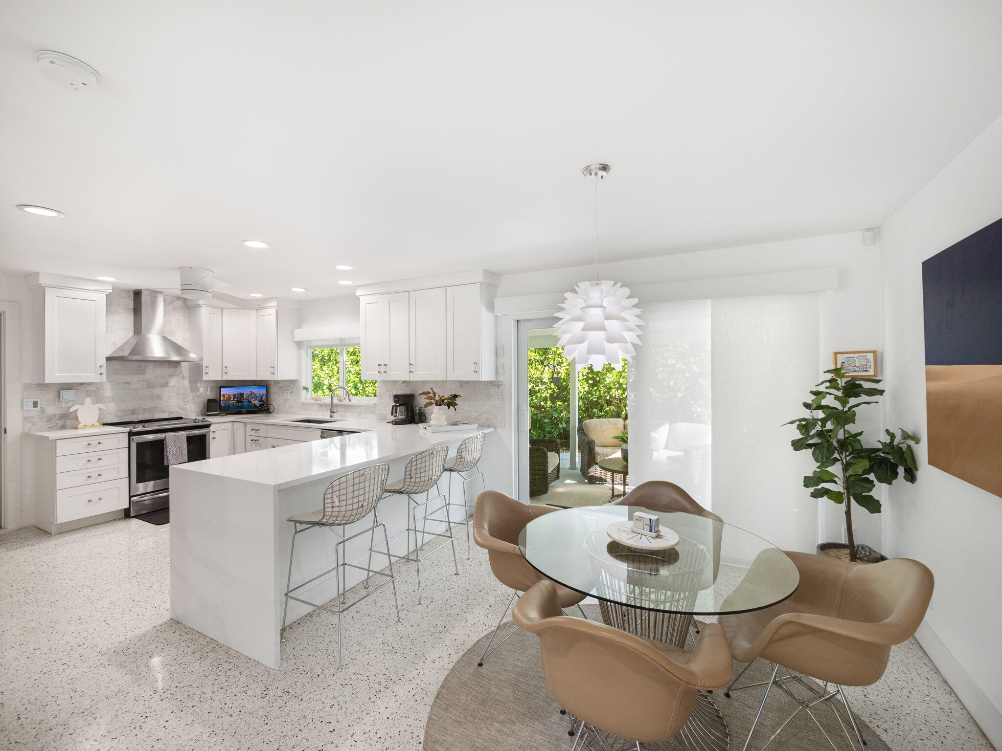 471 Mars Way Juno Beach, FL 33408 - Photo 8 of 29 a dining room with furniture and a kitchen view