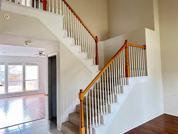 a view of entryway and hall with wooden floor