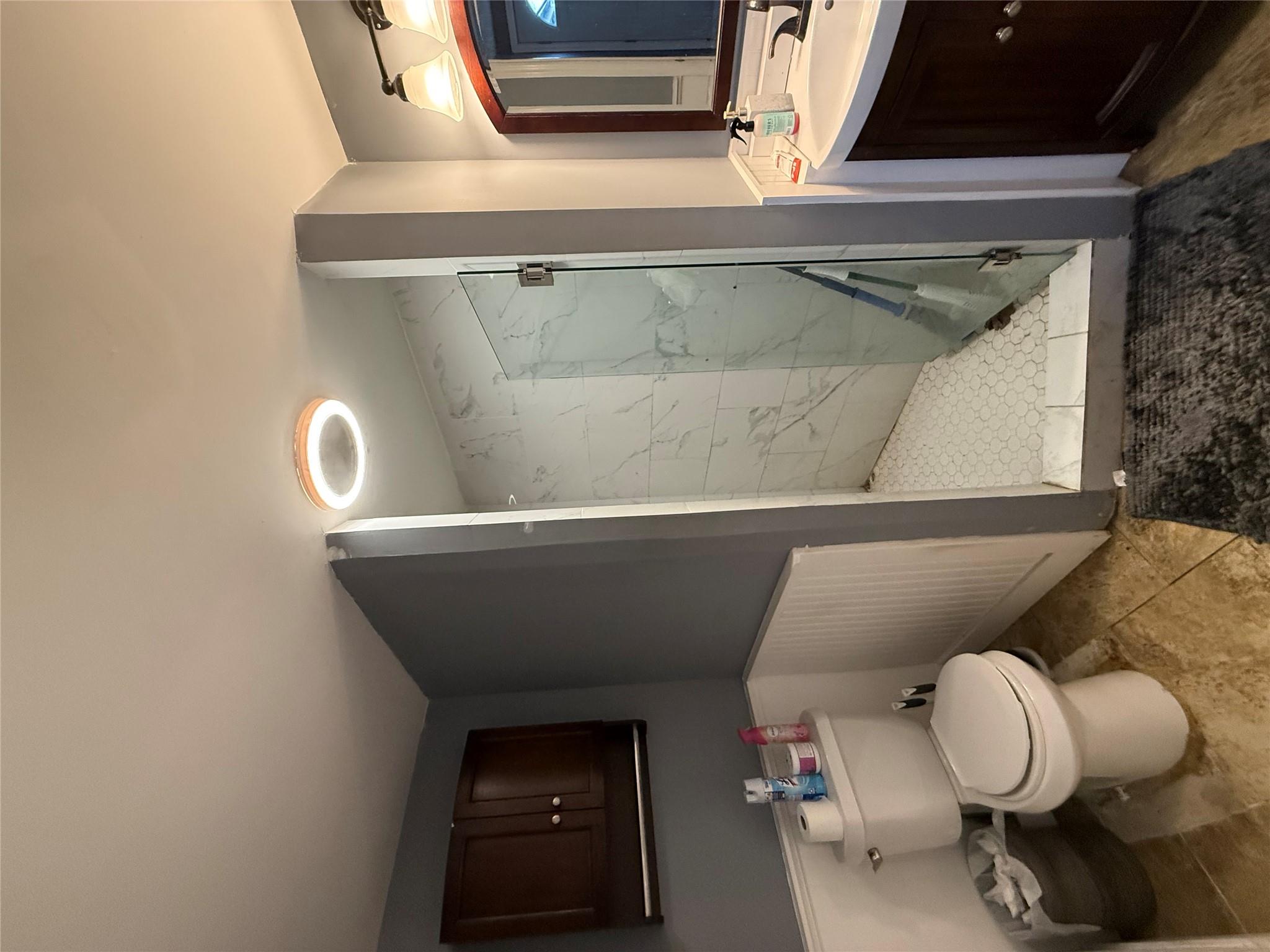 17 Hampton Road Shirley, NY 11967 - Photo 17 of 26 Full bathroom with vanity, wainscoting, a marble finish shower, and toilet