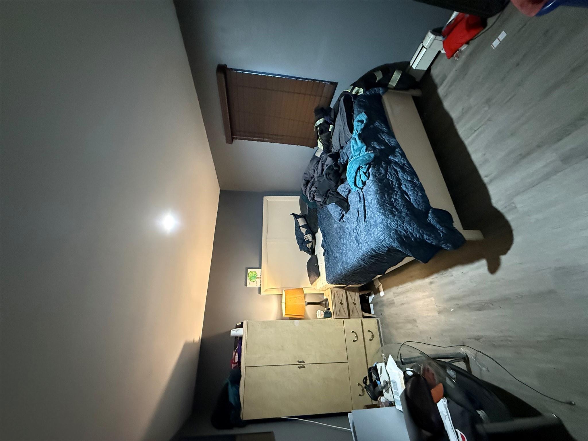 17 Hampton Road Shirley, NY 11967 - Photo 20 of 26 Bedroom with a baseboard radiator and wood finished floors