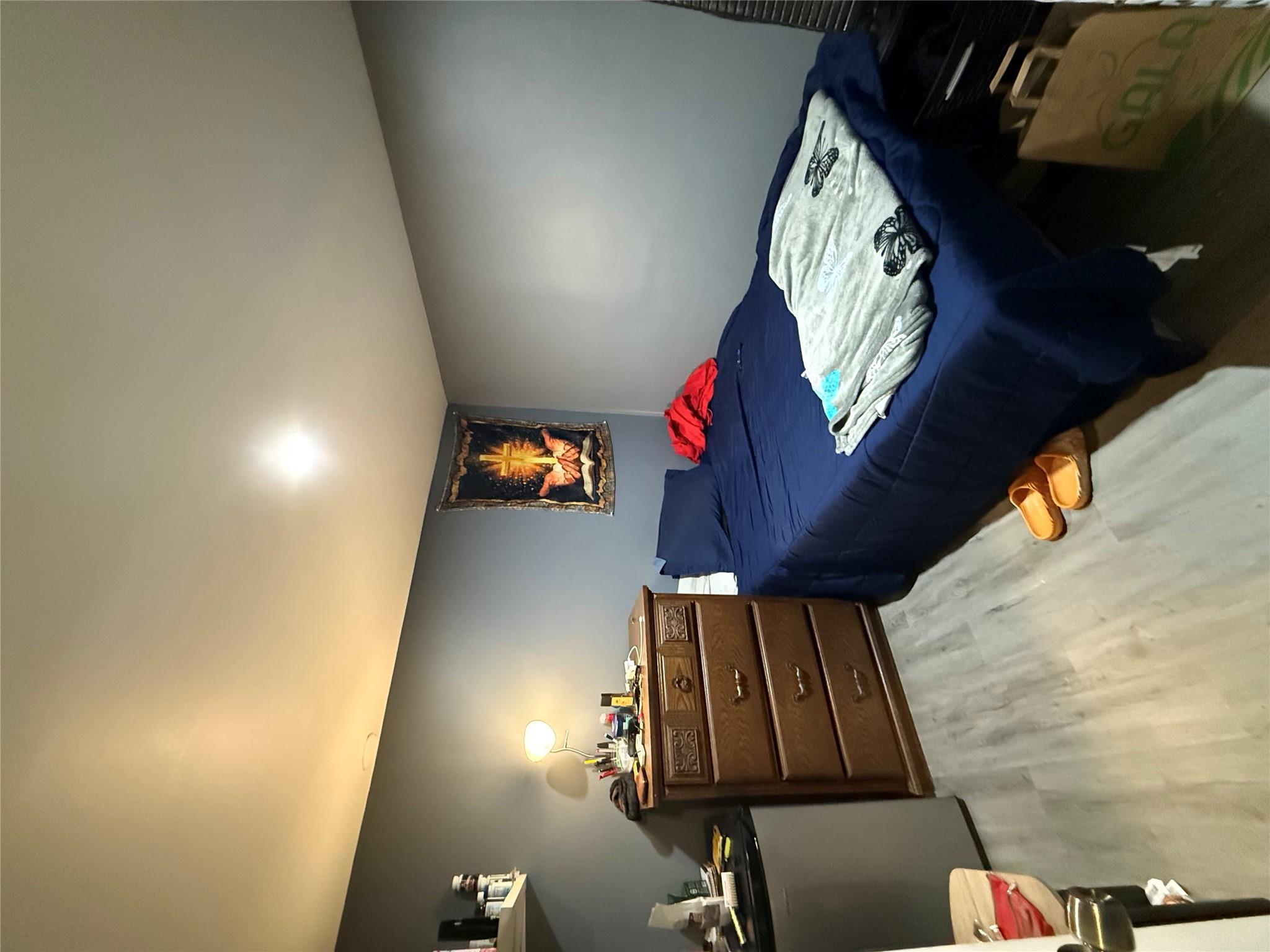 17 Hampton Road Shirley, NY 11967 - Photo 21 of 26 Bedroom featuring light wood-style floors and fridge