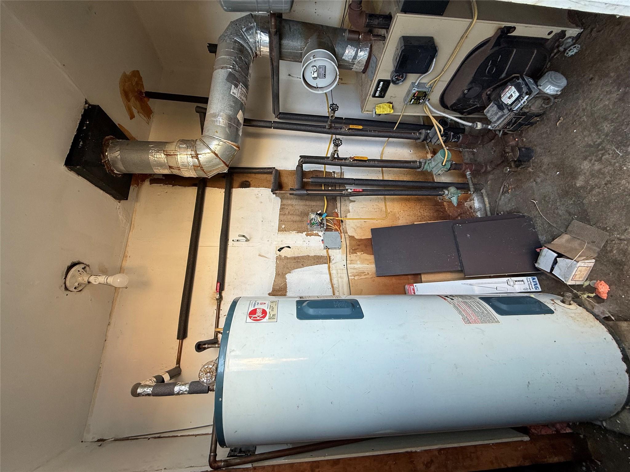 17 Hampton Road Shirley, NY 11967 - Photo 22 of 26 Utility room with a heating unit and water heater